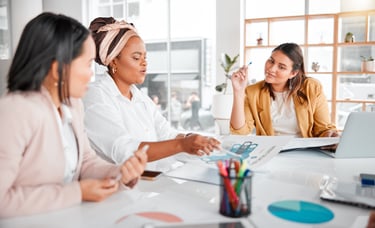 A group of business people in a meeting to discuss company growth.