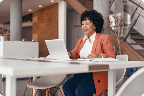 Healthcare professional working on laptop