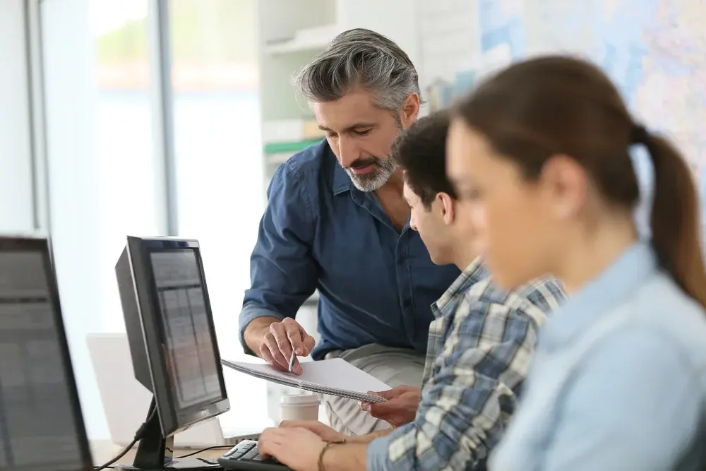 A group of business people in a meeting to discuss company growth.